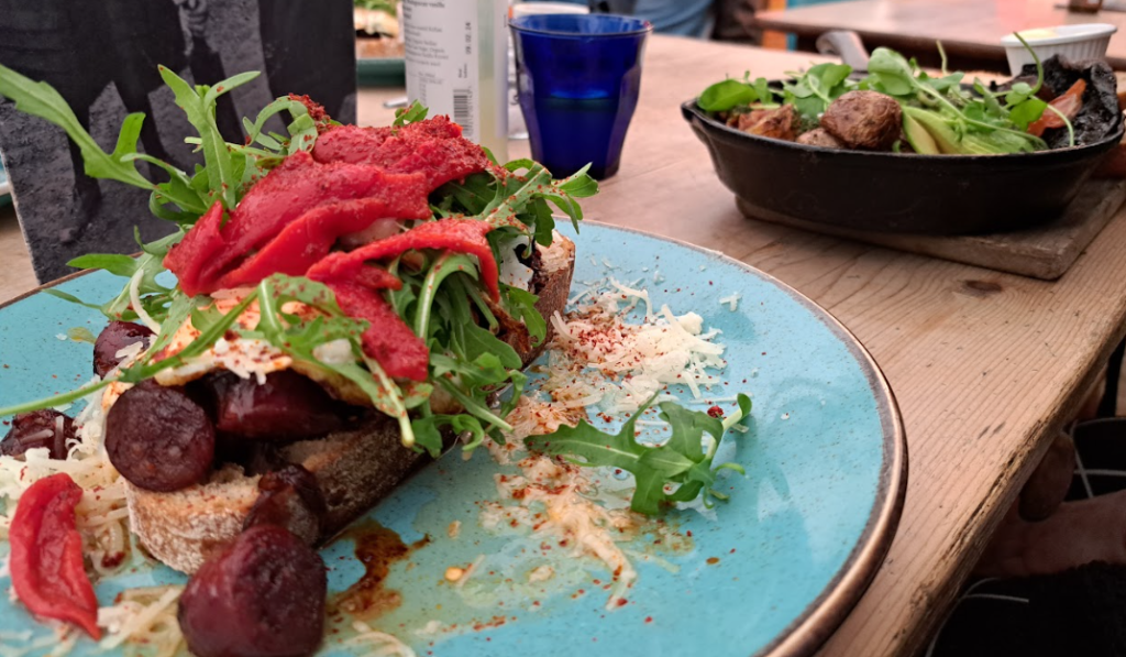 chorizo on toast and vegan breakfast from partisan, one of the best eateries near stations