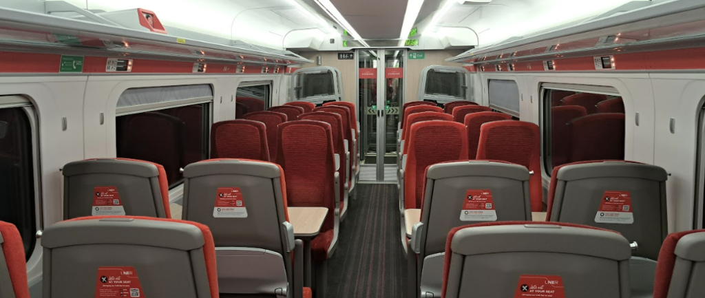 interior of an azuma newcastle to london train in standard class, showing 2+2 seating